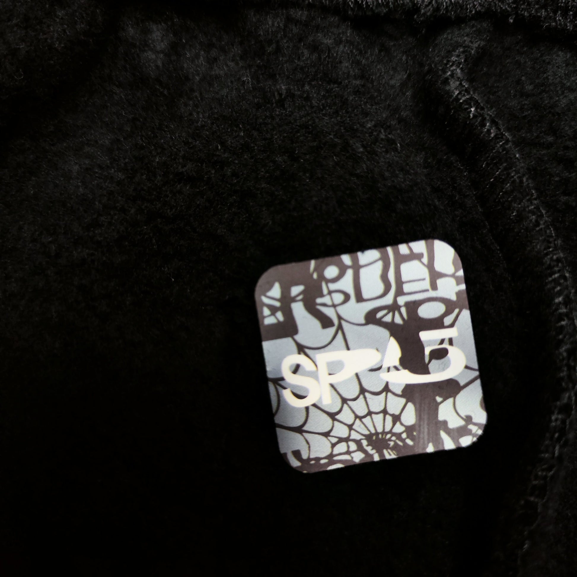 SP5DER OG Web black sweatpants inner waistband label detail