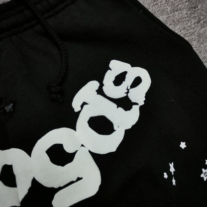 Close-up of defined puff-print edges on SP5DER OG Web sweatpants