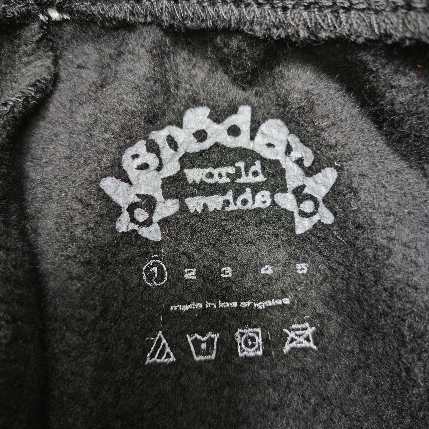 SP5DER Souvenir black sweatpants size label detail