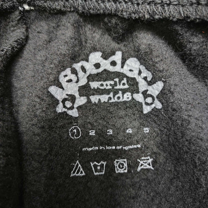 SP5DER Souvenir black sweatpants size label detail