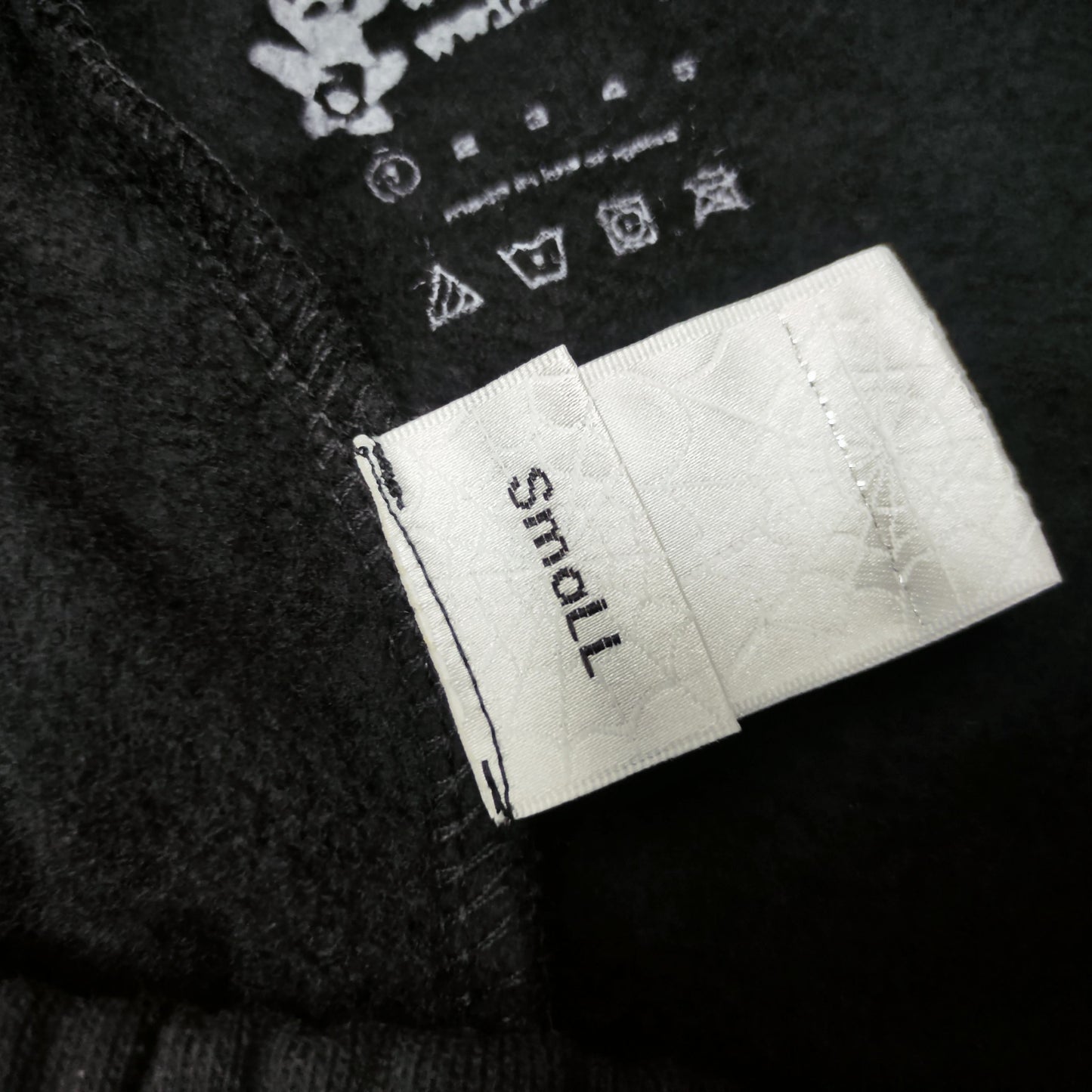 SP5DER Souvenir black sweatpants inner waistband label detail