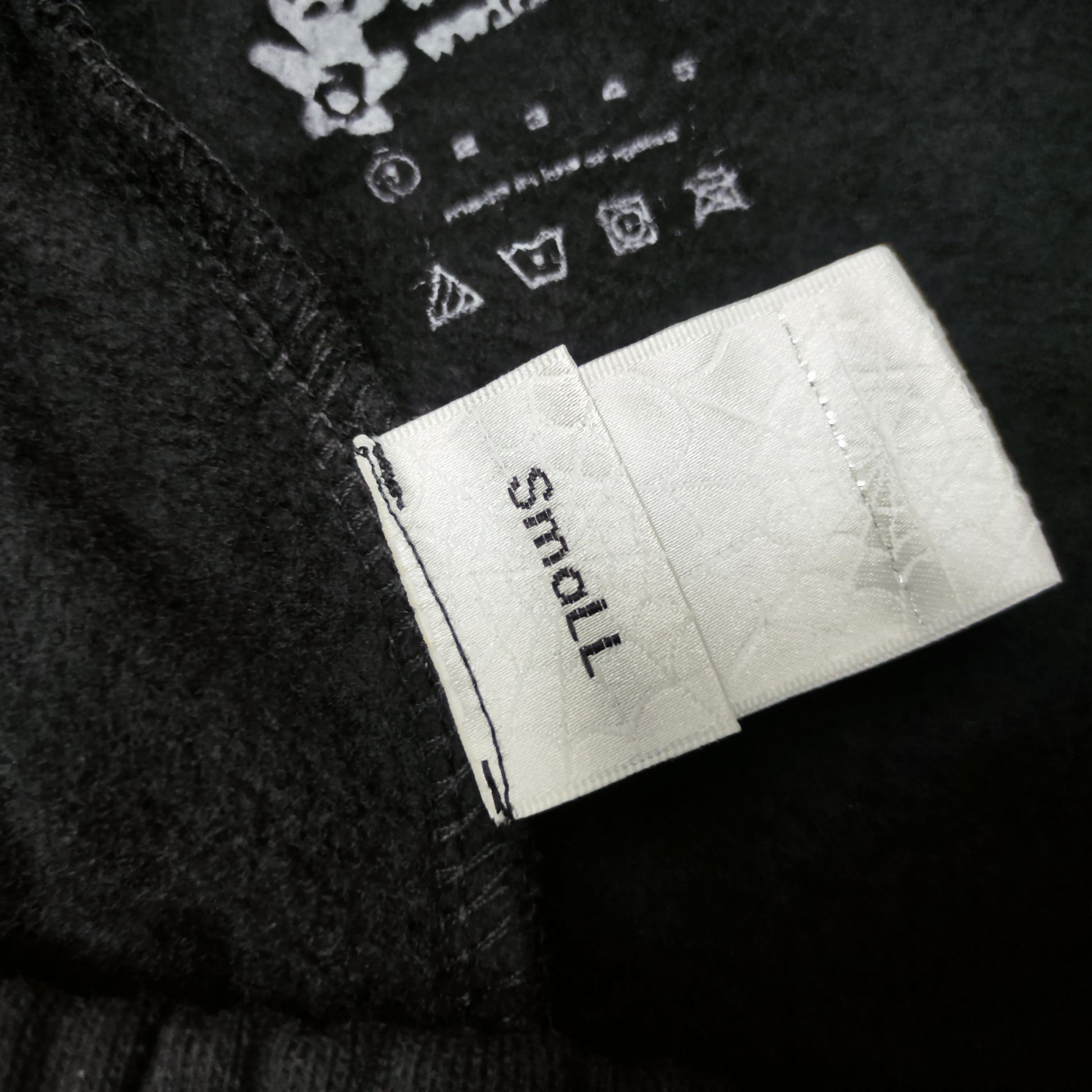 SP5DER Souvenir black sweatpants inner waistband label detail