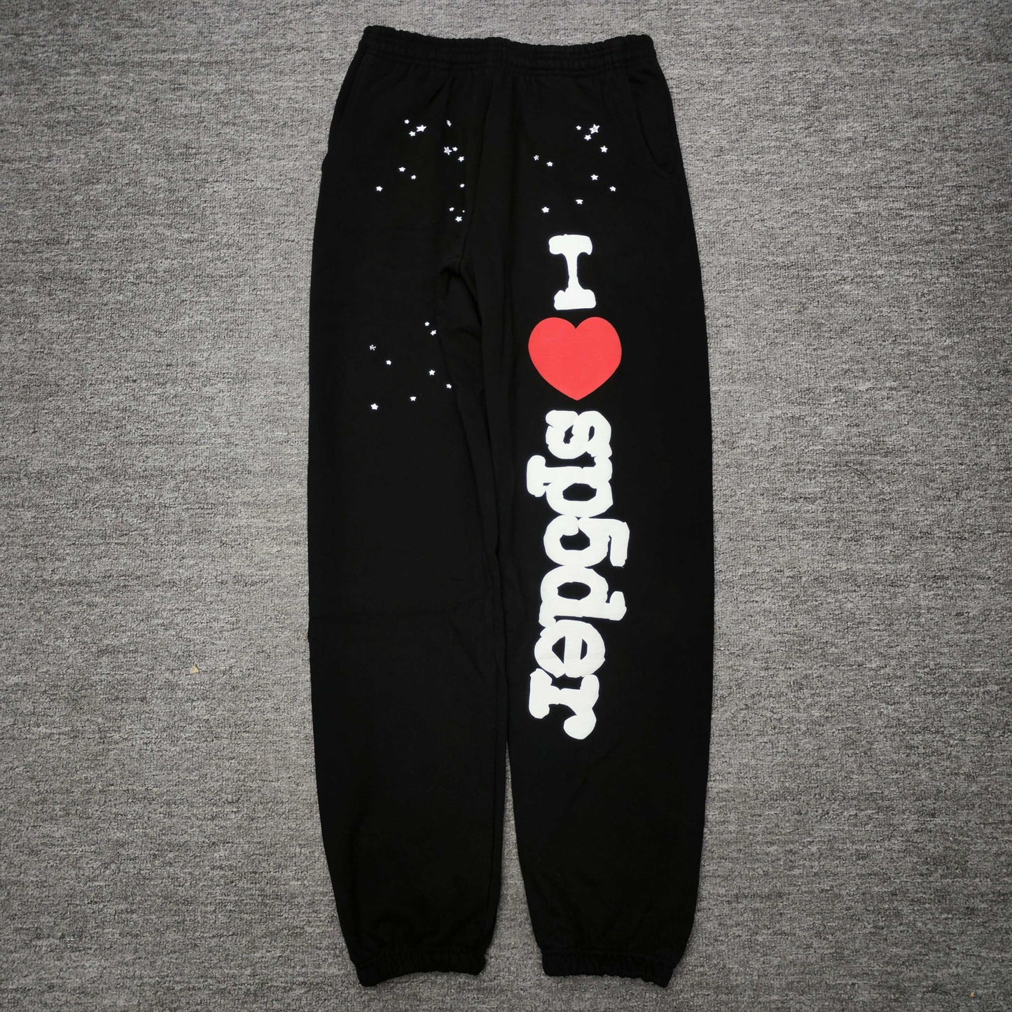 SP5DER Souvenir black sweatpants front view with white I Heart SP5DER graphic and red heart