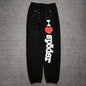 SP5DER Souvenir black sweatpants front view with white I Heart SP5DER graphic and red heart