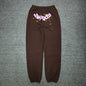 SP5DER Classic brown sweatpants front view with pink logo and yellow star graphics