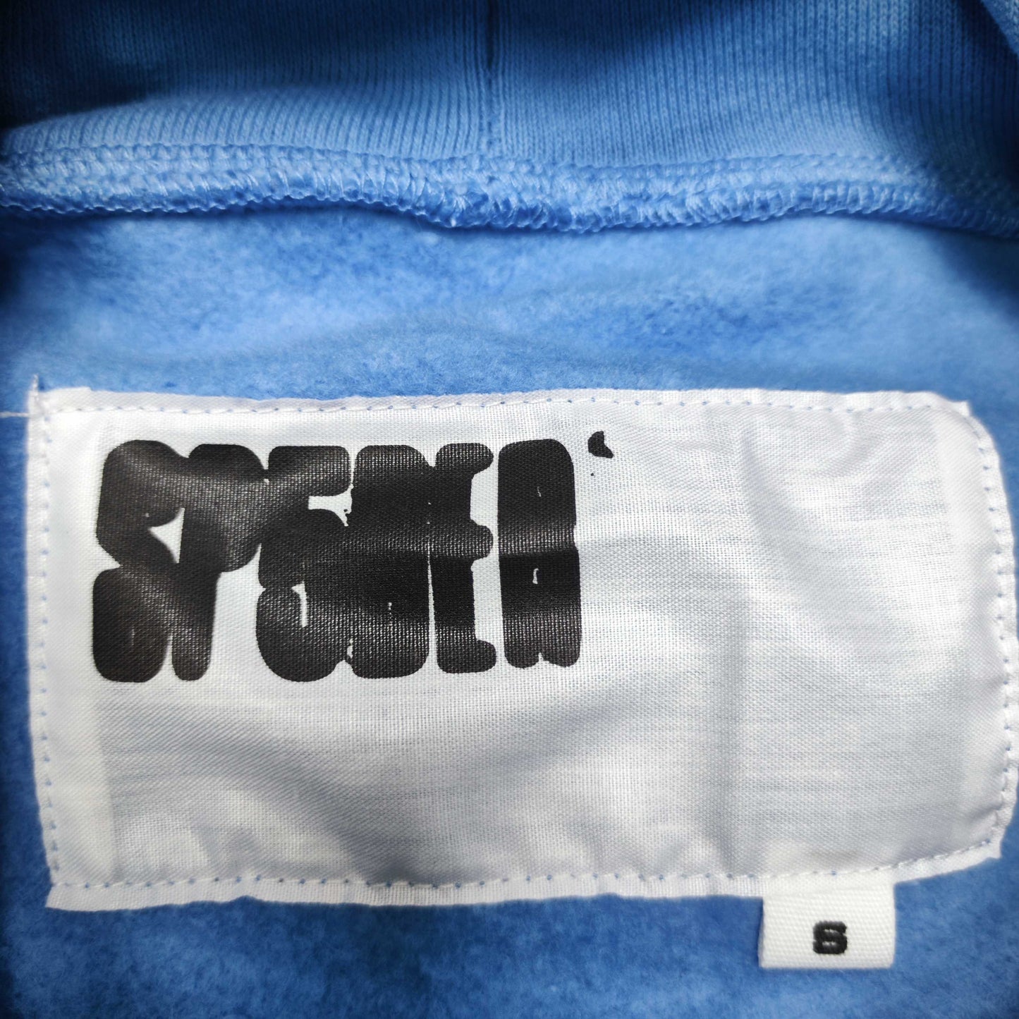 Sp5der OG Web V2 Hoodie Dusty Blue neck label and size tag detail
Sp5der OG Web V2 Hoodie Dusty Blue care label and washing instruction detail