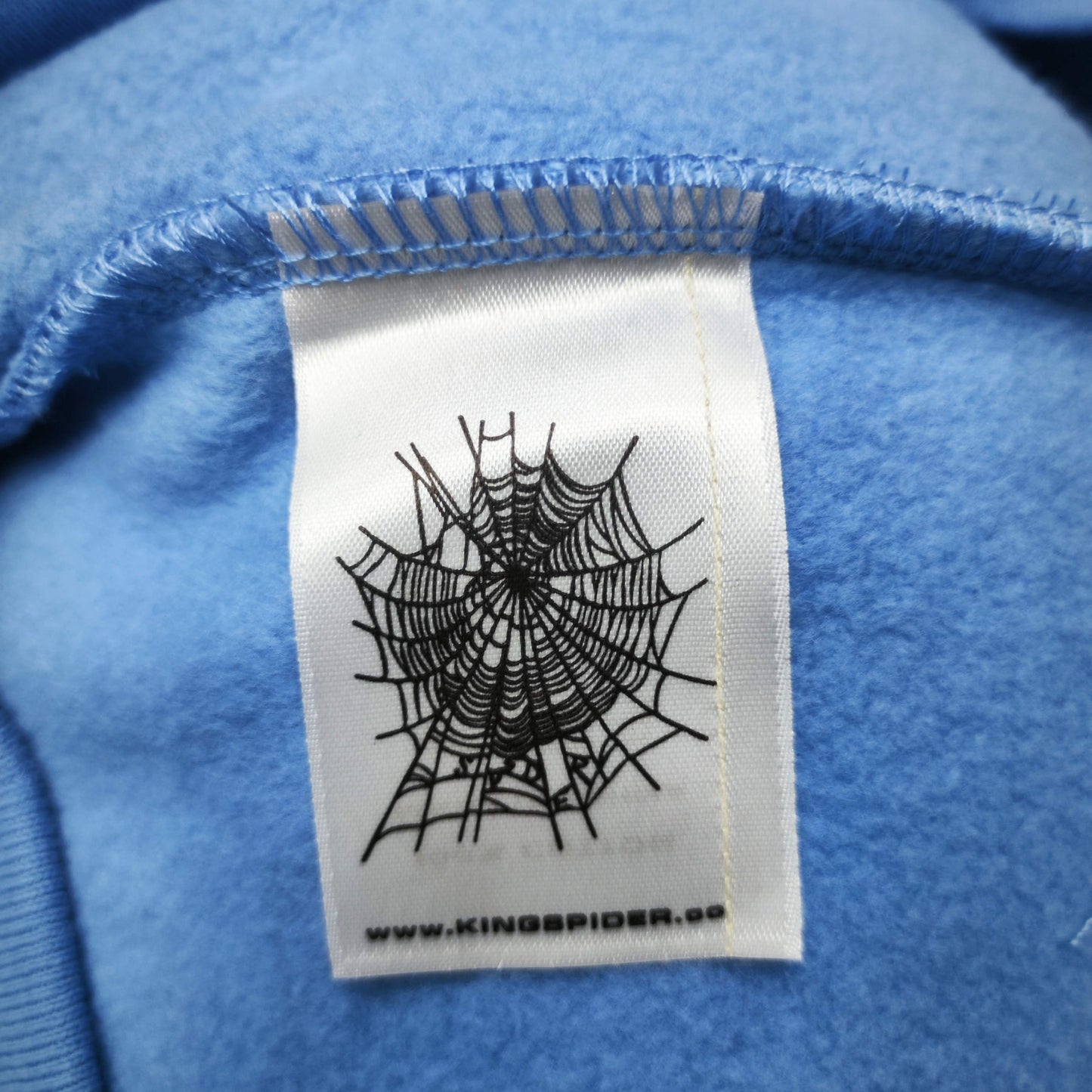 Sp5der OG Web V2 Hoodie Dusty Blue neck label and size tag detail
Sp5der OG Web V2 Hoodie Dusty Blue care label and washing instruction detail