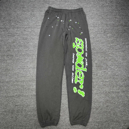 SP5DER Punk V2 slate grey sweatpants front view with green leg graphic and scattered stars