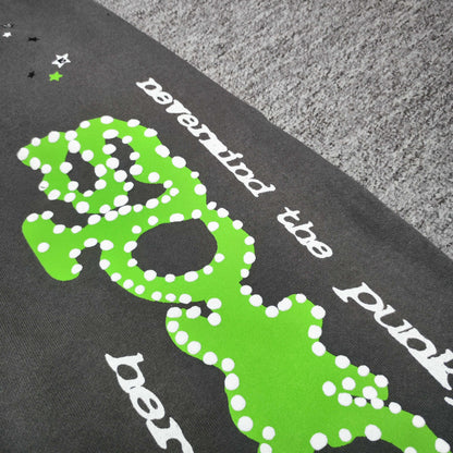 Close-up of green SP5DER puff-print graphic on slate grey Punk V2 sweatpants
White dot detailing around the green SP5DER graphic on Punk V2 sweatpants