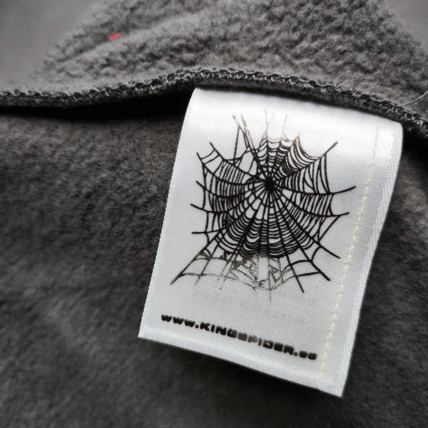 SP5DER Punk V2 slate grey sweatpants care label front view
Fabric composition details on SP5DER Punk V2 sweatpants care label