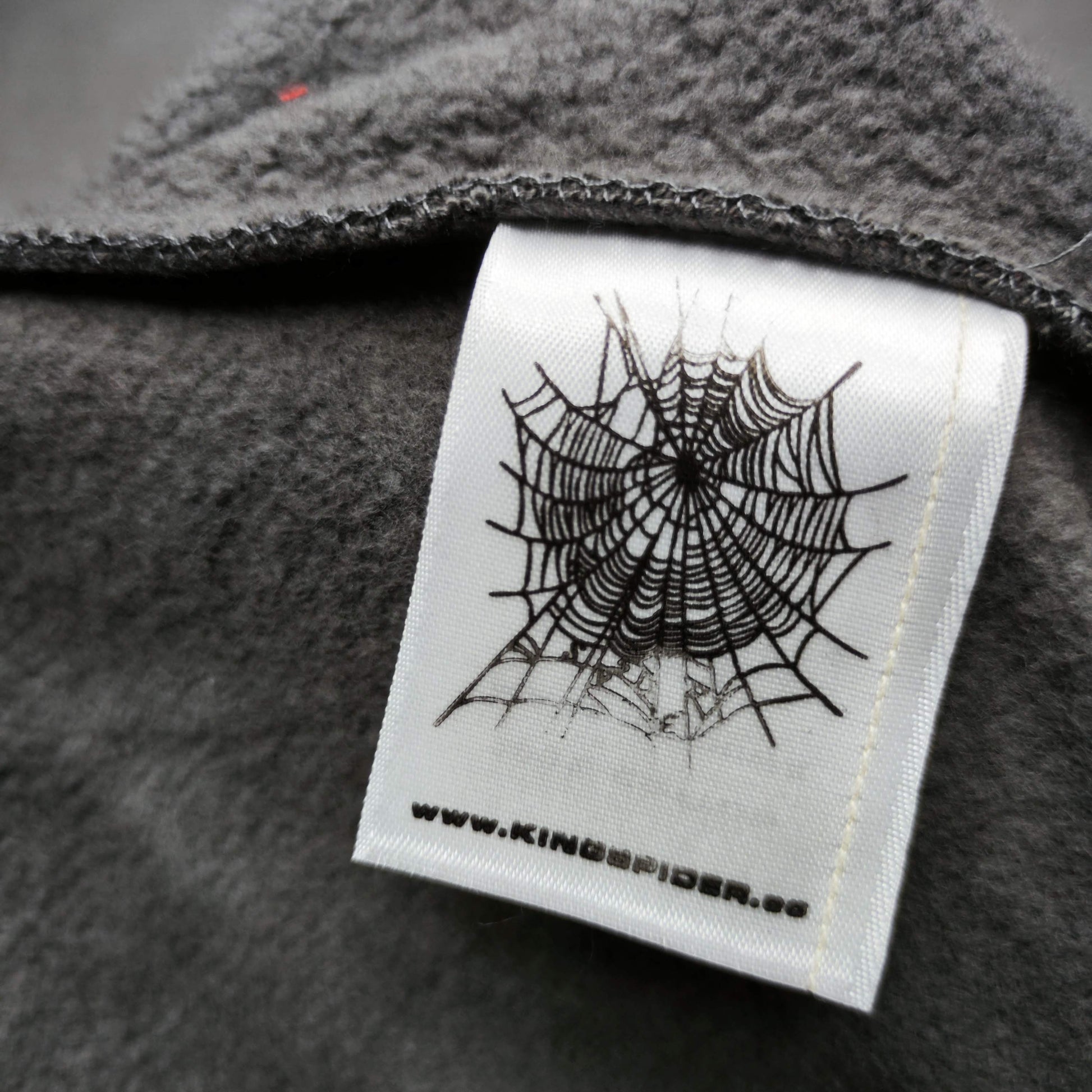 SP5DER Punk V2 slate grey sweatpants care label front view
Fabric composition details on SP5DER Punk V2 sweatpants care label