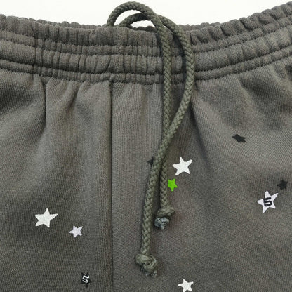 Scattered black white and green star graphics on SP5DER Punk V2 sweatpants
Elastic waistband detail on SP5DER Punk V2 slate grey sweatpants
Adjustable drawstring waist detail on SP5DER Punk V2 slate grey sweatpants