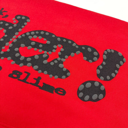Close-up of black SP5DER puff-print graphic on red P*NK V2 sweatpants
Raised black puff-print texture on SP5DER P*NK V2 red sweatpants
Close-up of defined puff-print edges on SP5DER P*NK V2 sweatpants