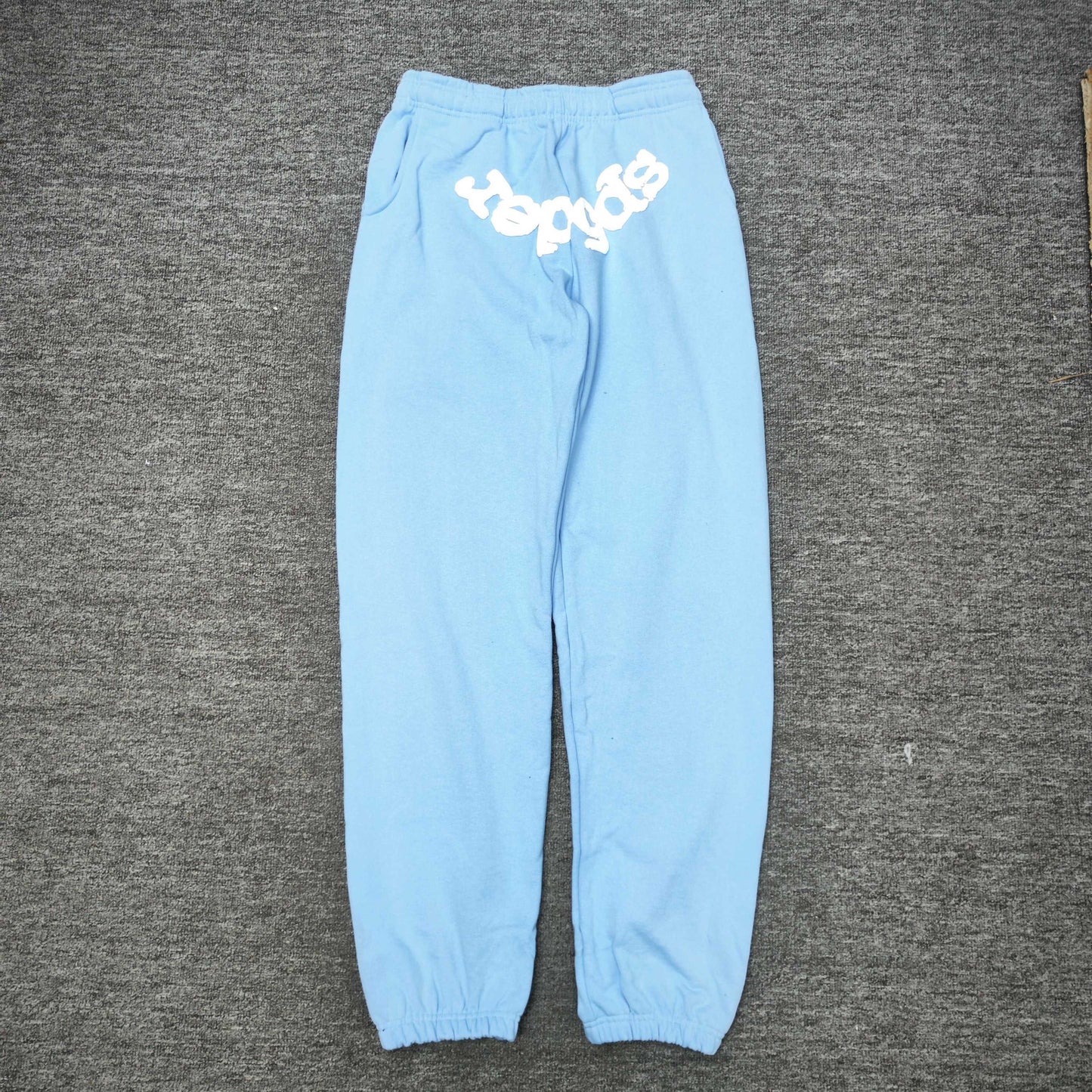 SP5DER Classic sky blue sweatpants front view with raised white logo