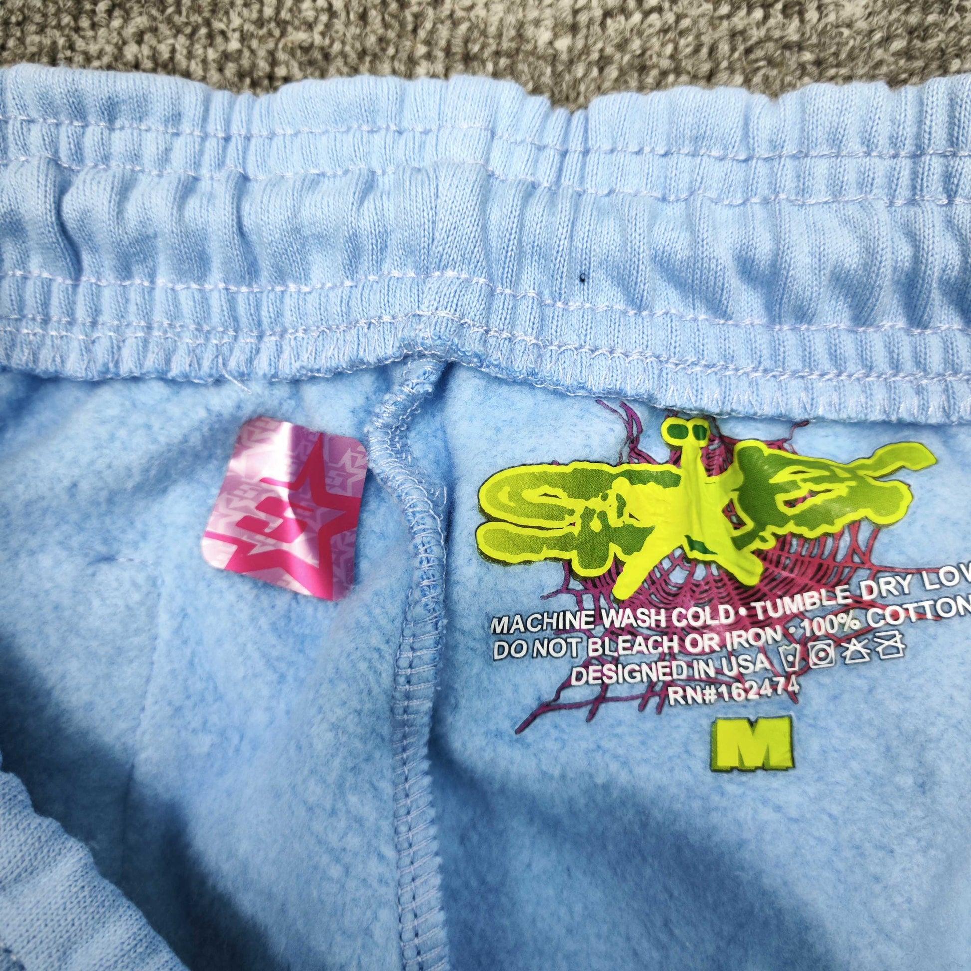 SP5DER Classic sky blue sweatpants inner waistband label detail