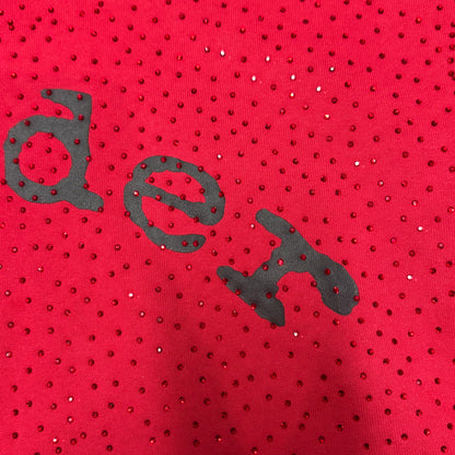 Full all-over tonal rhinestone design on Sp5der VVS Hoodie Red
Close-up of tonal rhinestone spacing and reflective details on Sp5der VVS Hoodie Red
Side angle showing the raised three-dimensional rhinestone texture on Sp5der VVS Hoodie
Close-up of black SP5DER chest lettering on the red VVS rhinestone hoodie