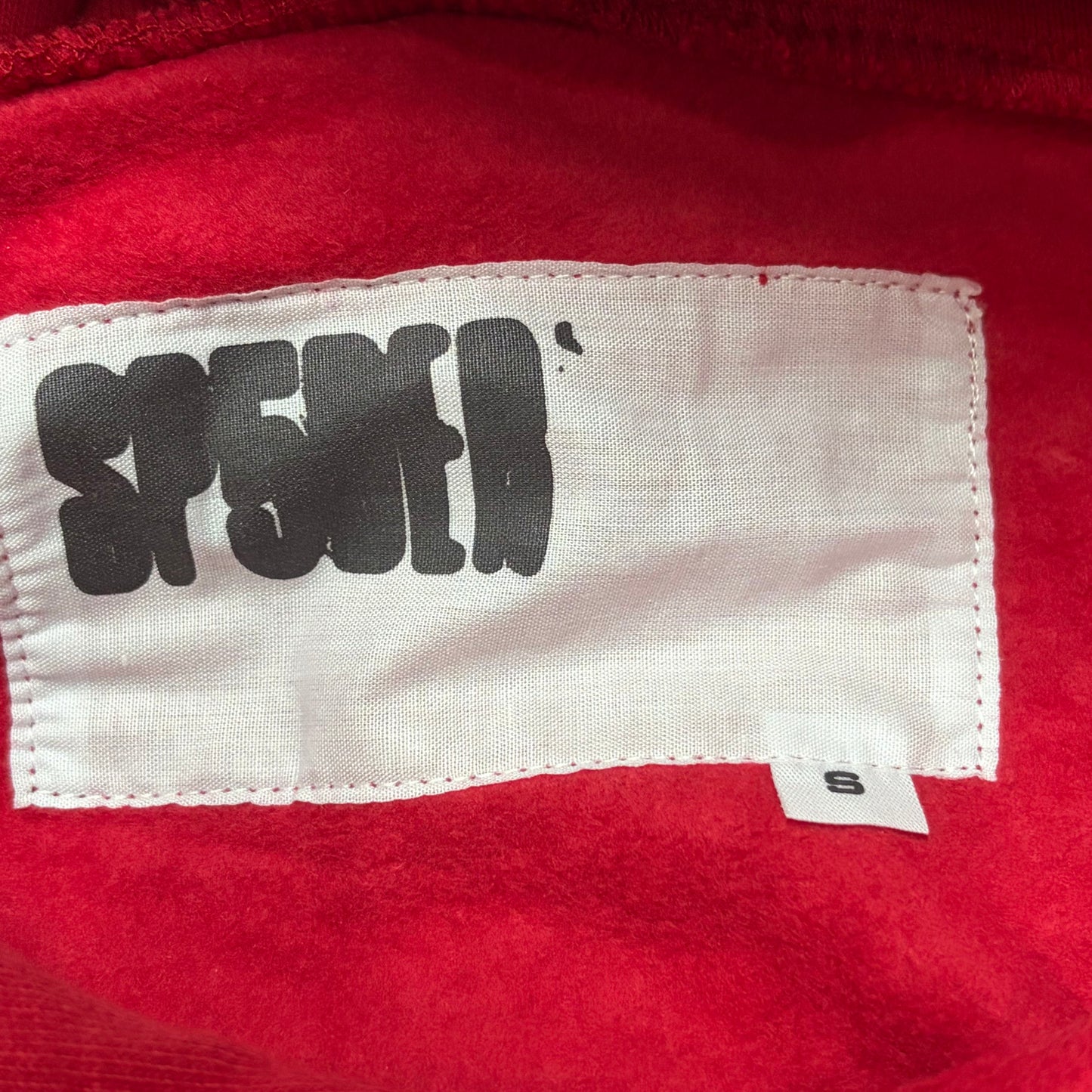 Sp5der VVS Hoodie neck label and size tag detail
Sp5der VVS Hoodie care label and washing instruction detail