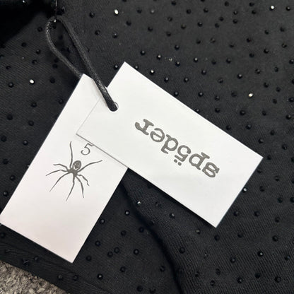 Sp5der VVS Hoodie neck label and size tag detail
Sp5der VVS Hoodie care label and washing instruction detail