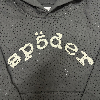 Full all-over tonal rhinestone design on Sp5der VVS Hoodie Black
Close-up of black rhinestone spacing and reflective details on Sp5der VVS Hoodie Black
Side angle showing the raised three-dimensional rhinestone texture on Sp5der VVS Hoodie
Close-up of contrasting SP5DER chest lettering on the black VVS rhinestone hoodie