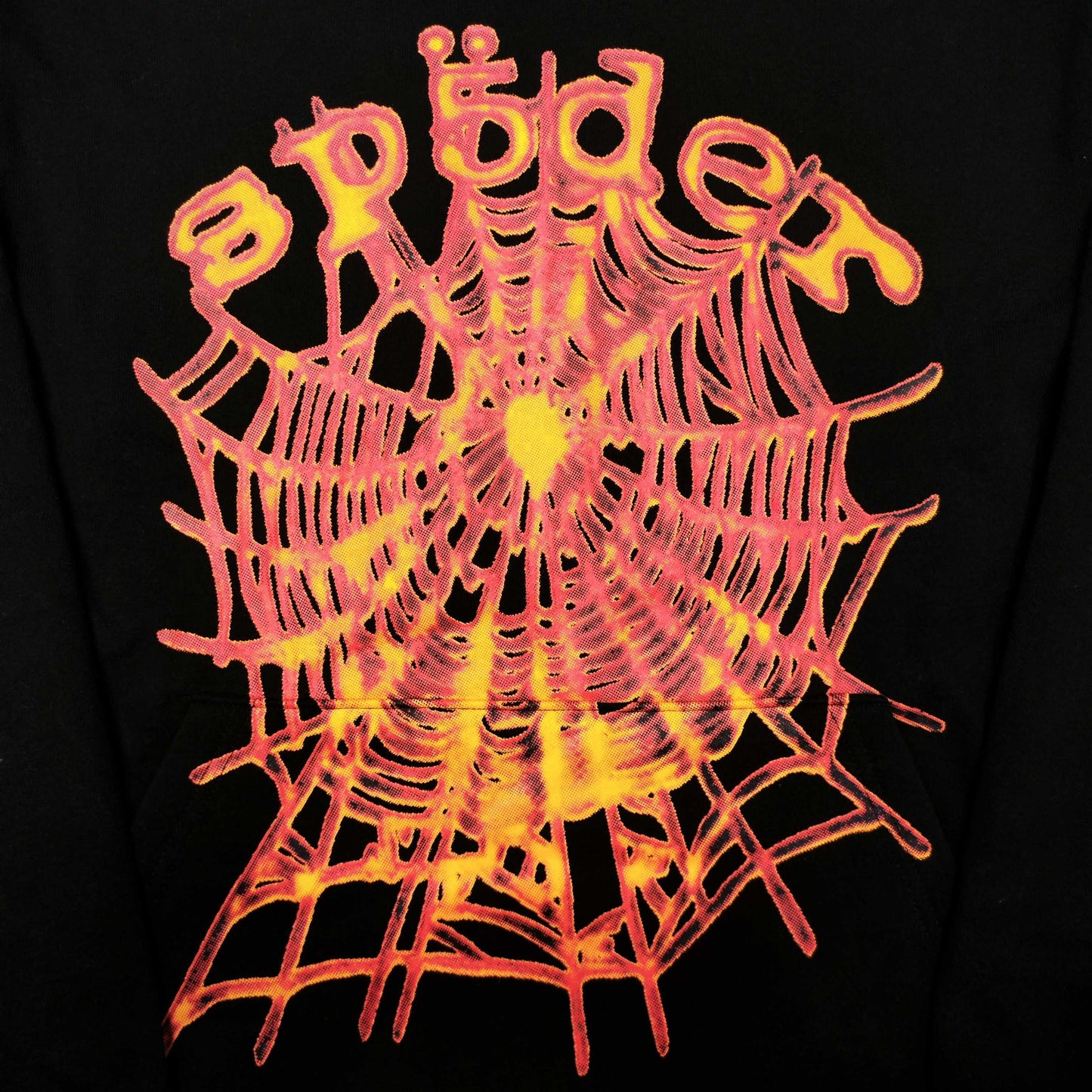 Full front artwork on Sp5der OG Web V2 Hoodie Black with multicolor puff logo and spider web
Close-up of raised multicolor SP5DER puff-print lettering on the black OG Web V2 Hoodie
Close-up of pink orange and yellow OG Web V2 graphic on Sp5der Hoodie Black
