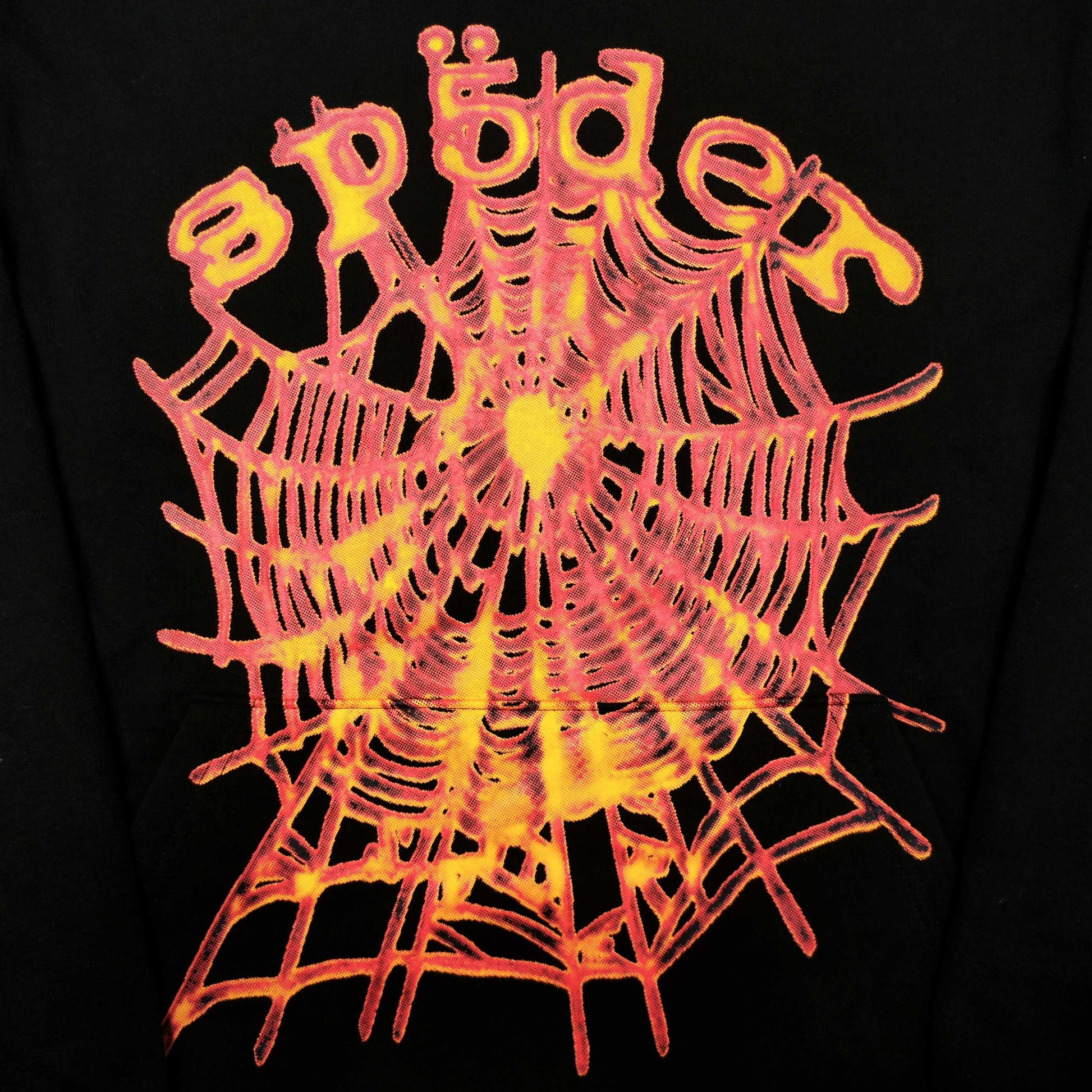 Full front artwork on Sp5der OG Web V2 Hoodie Black with multicolor puff logo and spider web
Close-up of raised multicolor SP5DER puff-print lettering on the black OG Web V2 Hoodie
Close-up of pink orange and yellow OG Web V2 graphic on Sp5der Hoodie Black