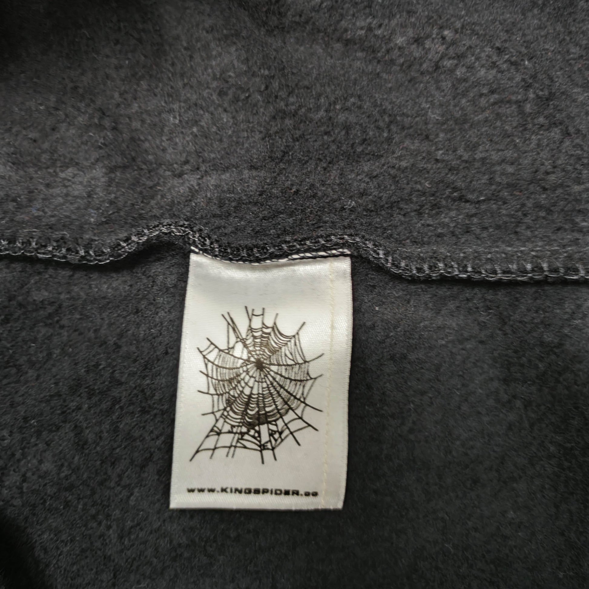 Sp5der OG Web V2 Hoodie Black neck label and size tag detail
Sp5der OG Web V2 Hoodie Black care label and washing instruction detail