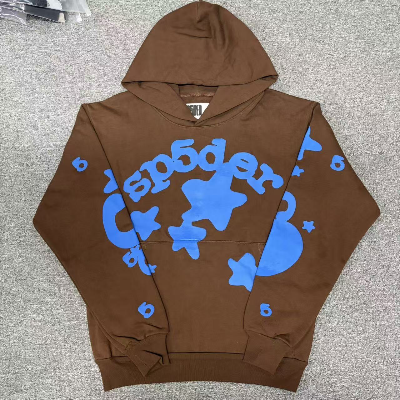Sp5der Beluga Hoodie Brown front view with raised blue lettering and oversized star graphics