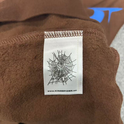 Sp5der Beluga Hoodie Brown neck label and size tag detail
Sp5der Beluga Hoodie Brown care label and washing instruction detail