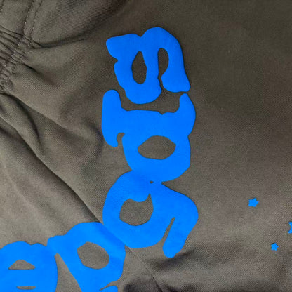 Raised blue puff-print texture on SP5DER Beluga V2 brown sweatpants
Close-up of clean puff-print edges on SP5DER Beluga V2 sweatpants