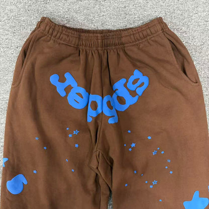 Blue SP5DER logo oversized 5 and star graphics on Beluga V2 brown sweatpants