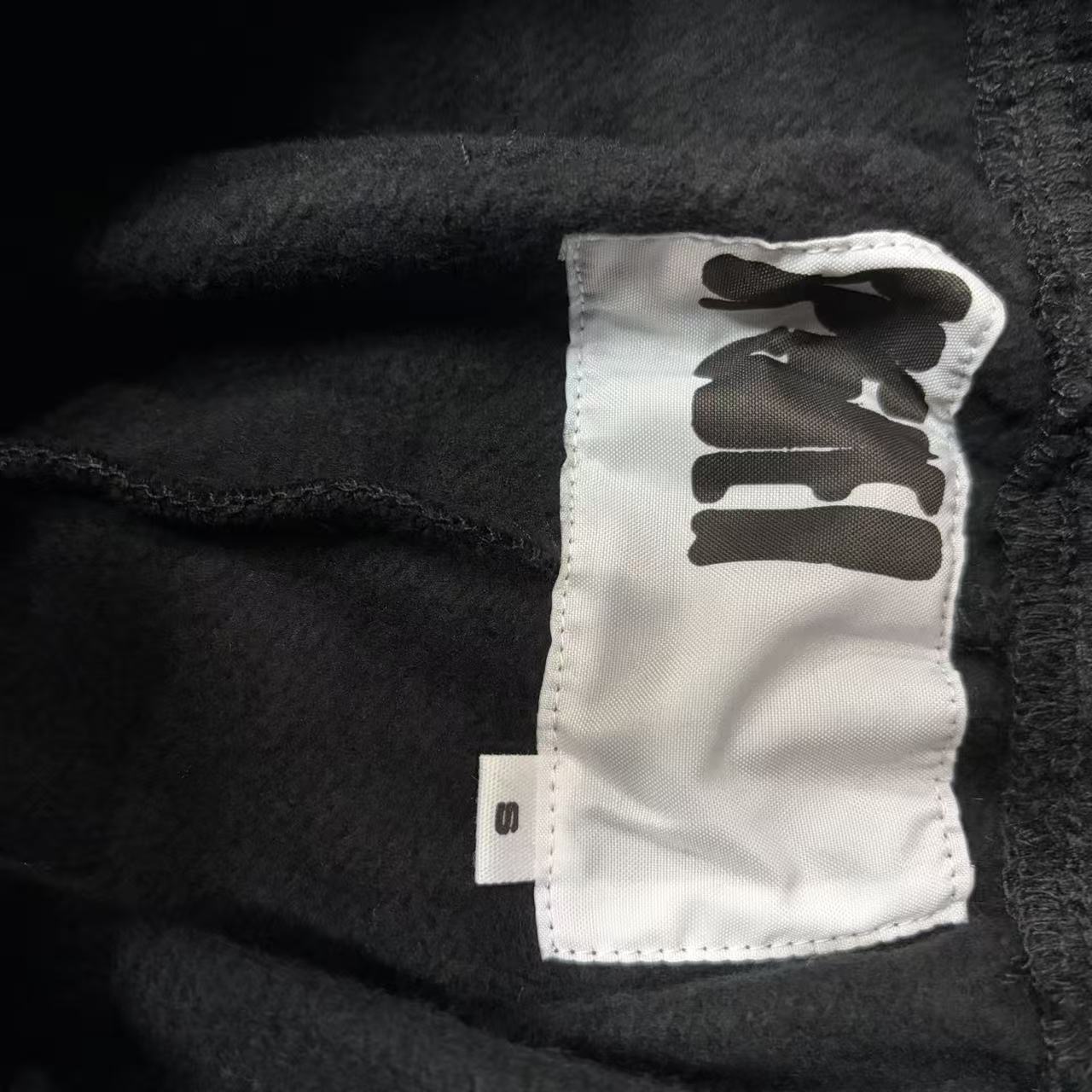 SP5DER Issue 404 black sweatpants inner waistband label detail