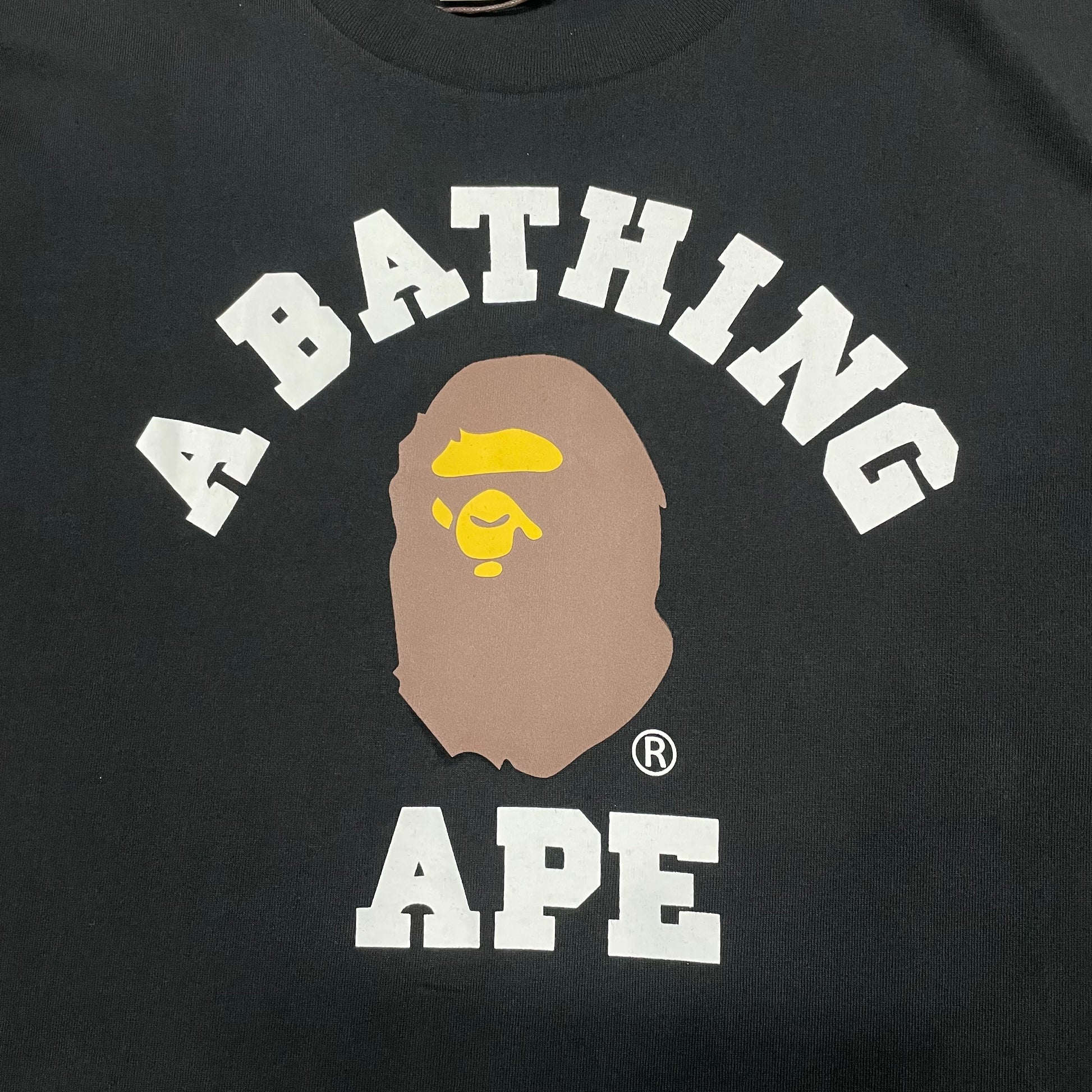 BAPE College lettering and Ape Head graphic detail on black T-shirt
