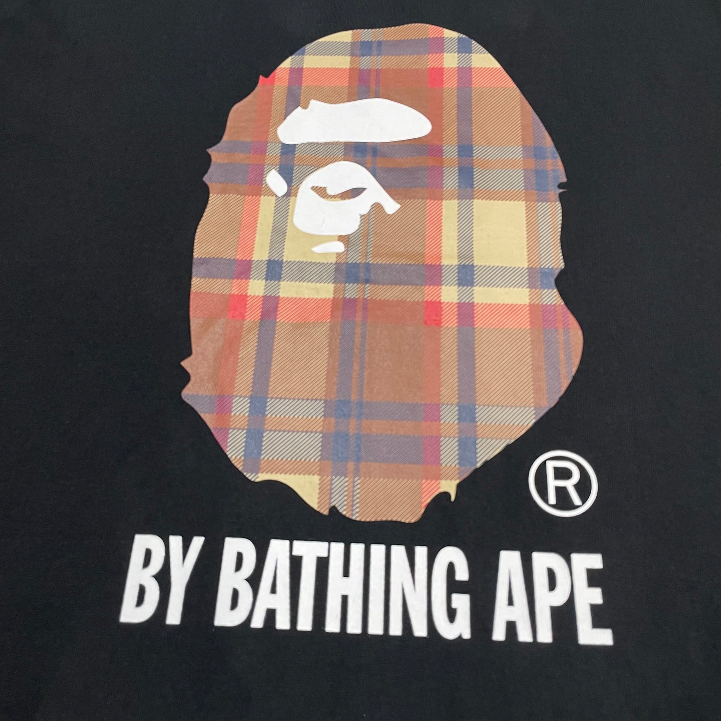 BAPE Brown plaid Ape Head graphic detail on black T-shirt