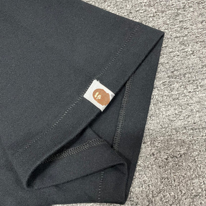 BAPE Check graphic T-shirt sleeve label and stitching detail
