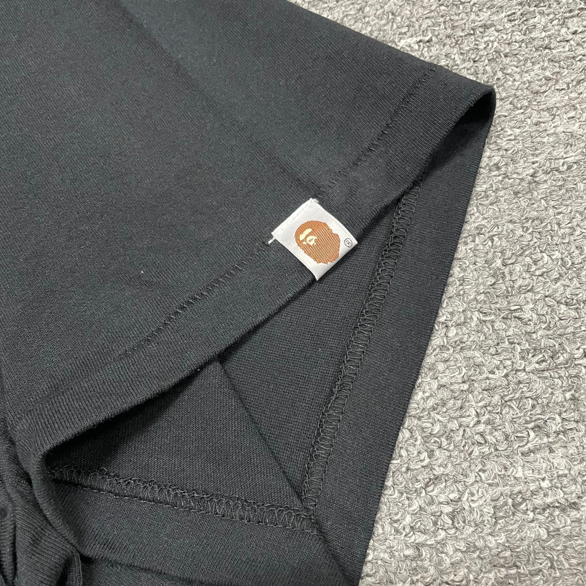 BAPE ABC camo T-shirt sleeve label and stitching detail