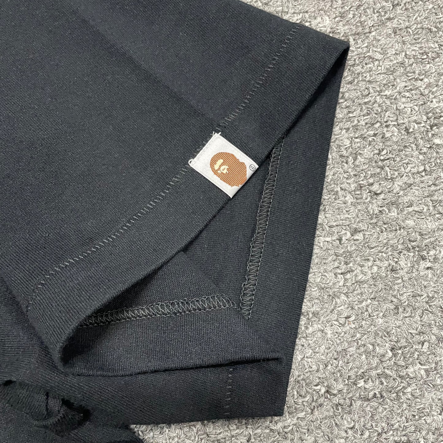 BAPE Purple camo T-shirt sleeve label and stitching detail