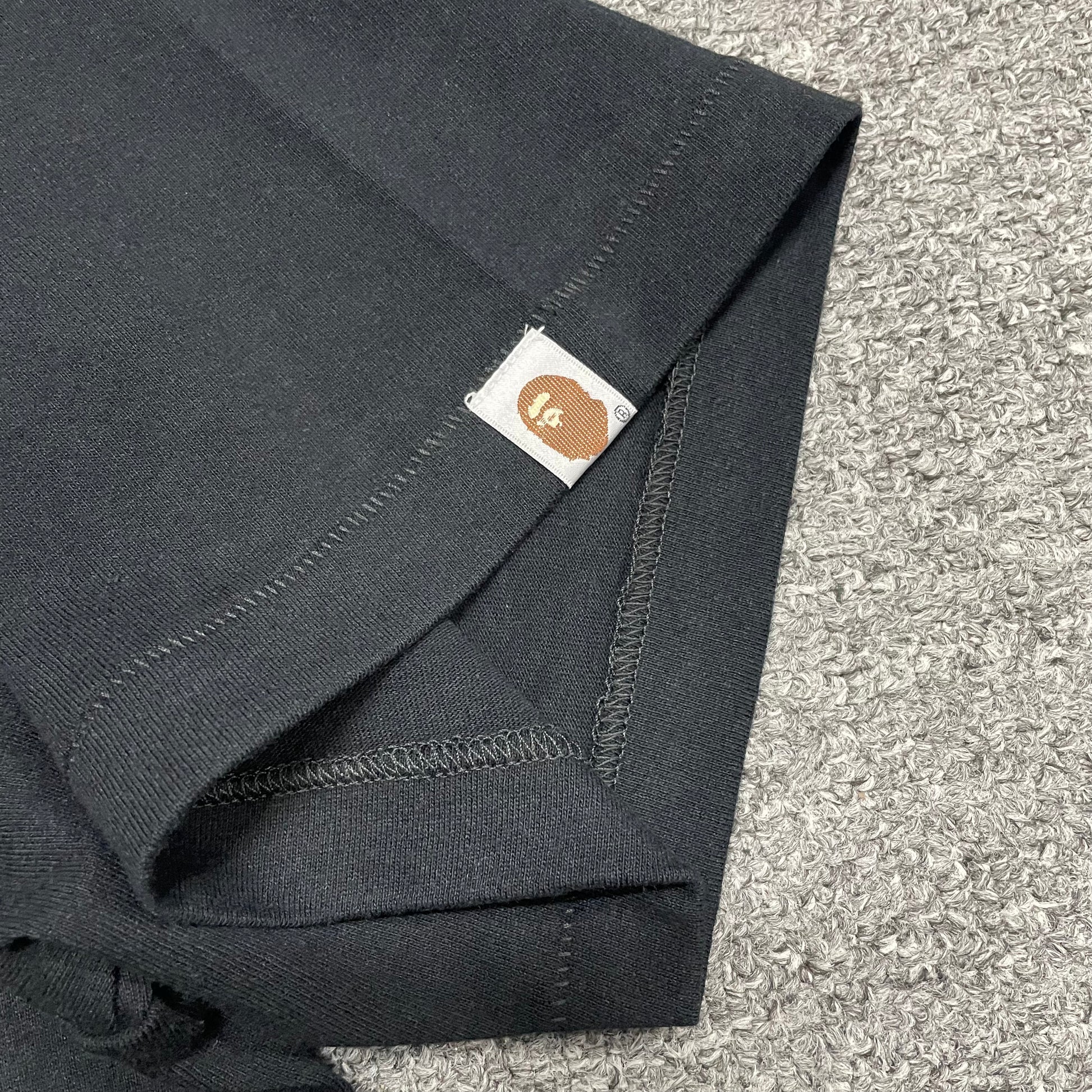 BAPE Purple camo T-shirt sleeve label and stitching detail