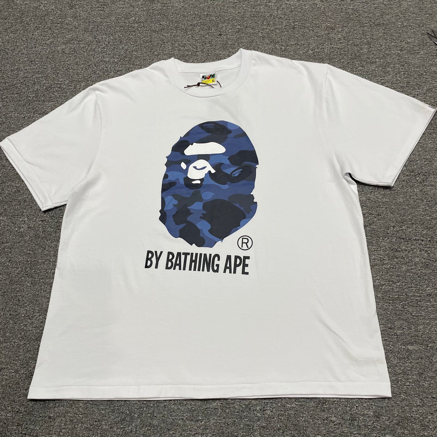 White BAPE ABC Camo Big Ape Head T-shirt front view with blue camouflage graphic