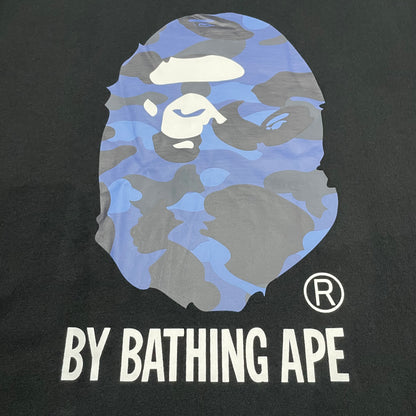 Close-up of blue ABC Camo Ape Head rubber print on black T-shirt