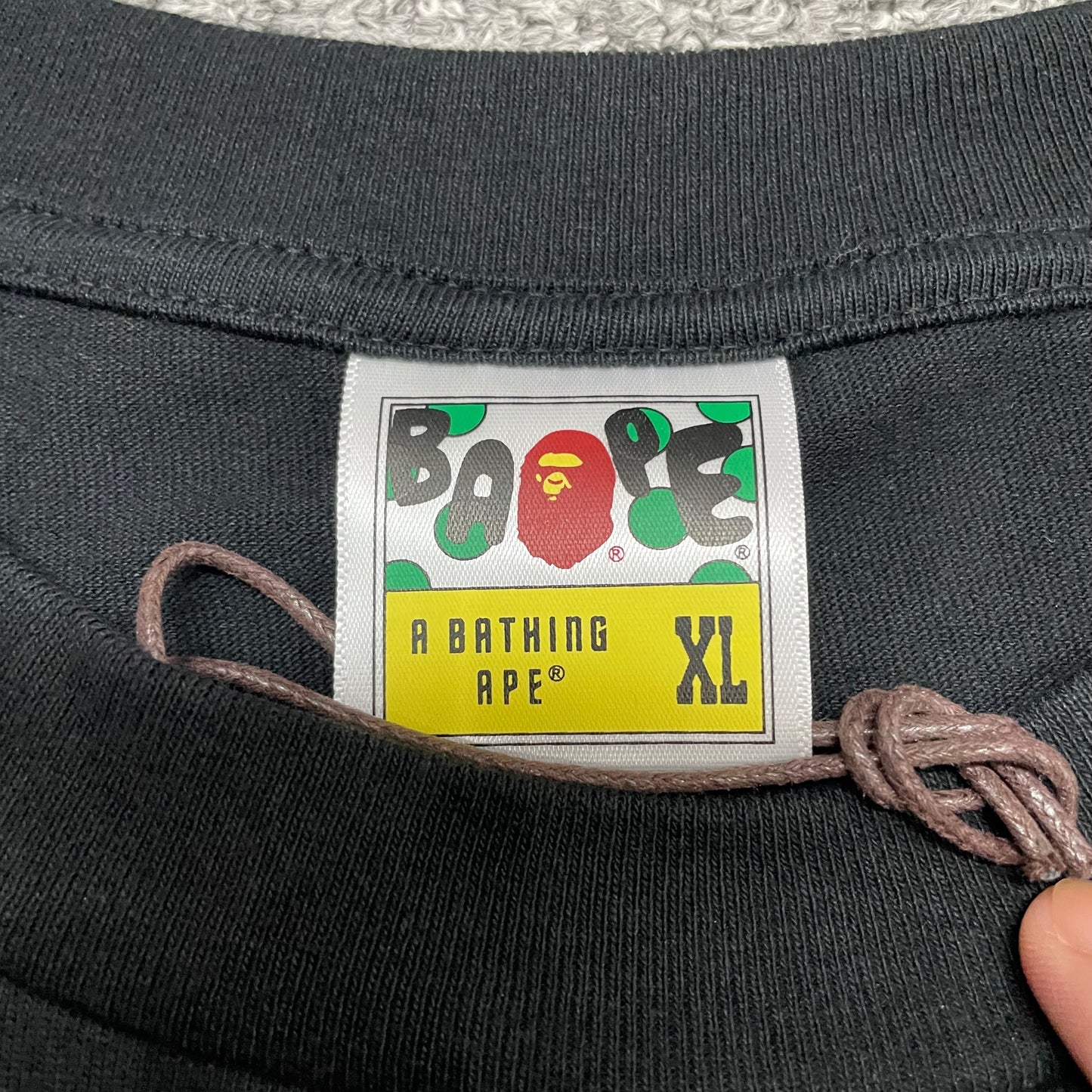 BAPE neck label detail on black ABC Camo Big Ape Head T-shirt