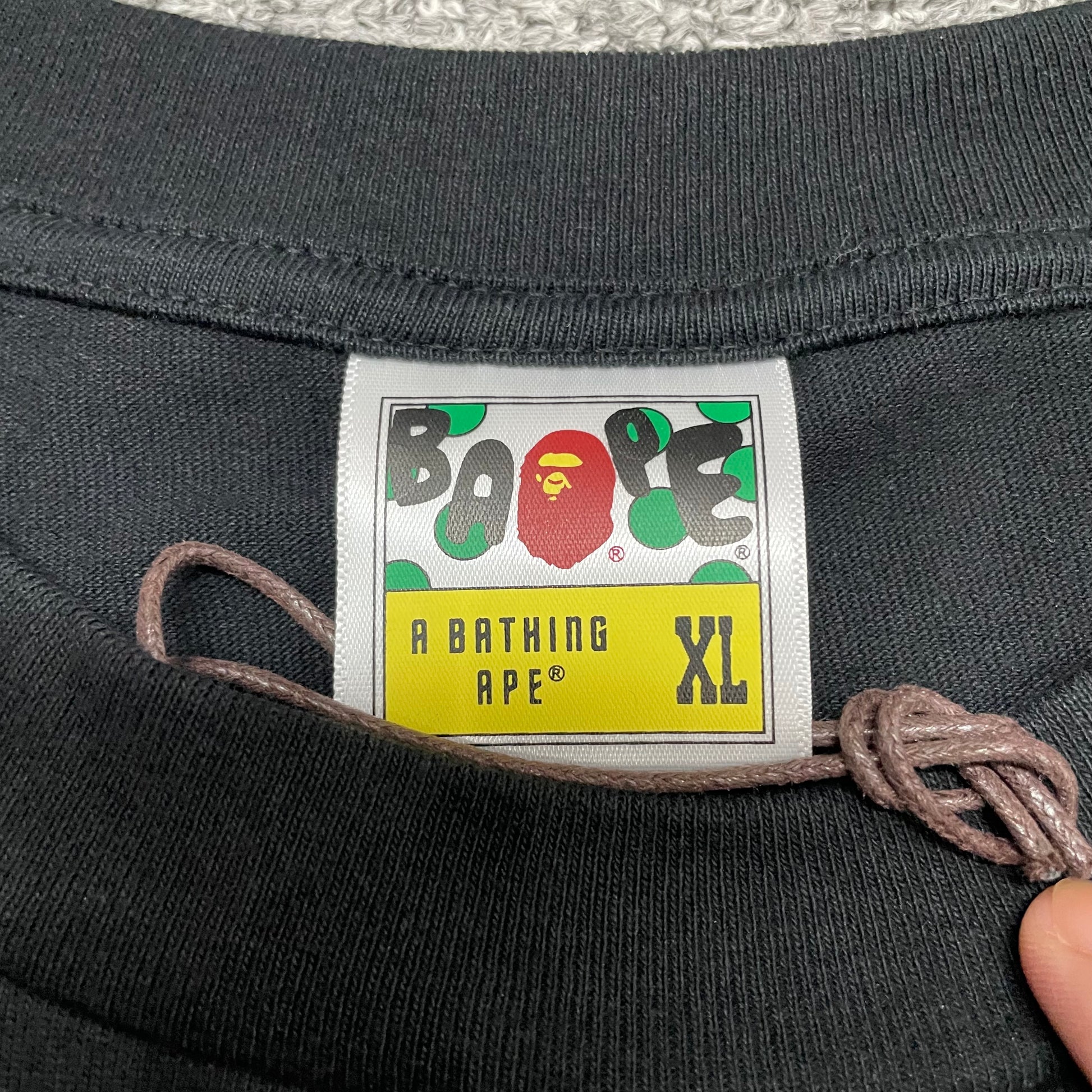 BAPE neck label detail on black ABC Camo Big Ape Head T-shirt