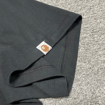 Sleeve label detail on black BAPE ABC Camo Big Ape Head T-shirt