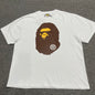 White BAPE Big Ape Head T-shirt front view with brown and yellow graphic