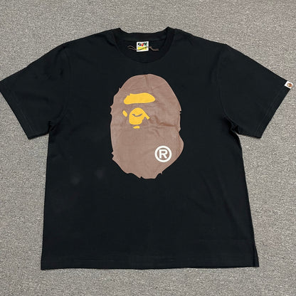 Black BAPE Big Ape Head T-shirt front view with brown and yellow graphic