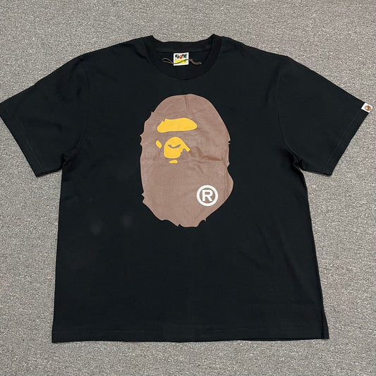 Black BAPE Big Ape Head T-shirt front view with brown and yellow graphic