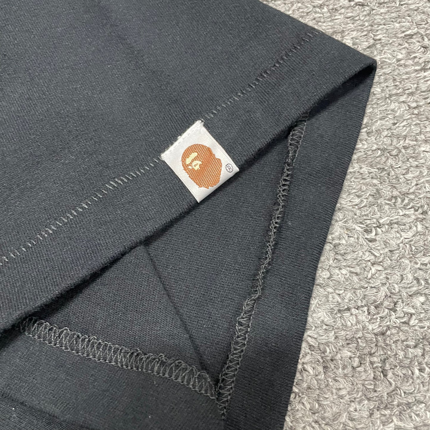 Sleeve label detail of black BAPE Big Ape Head T-shirt