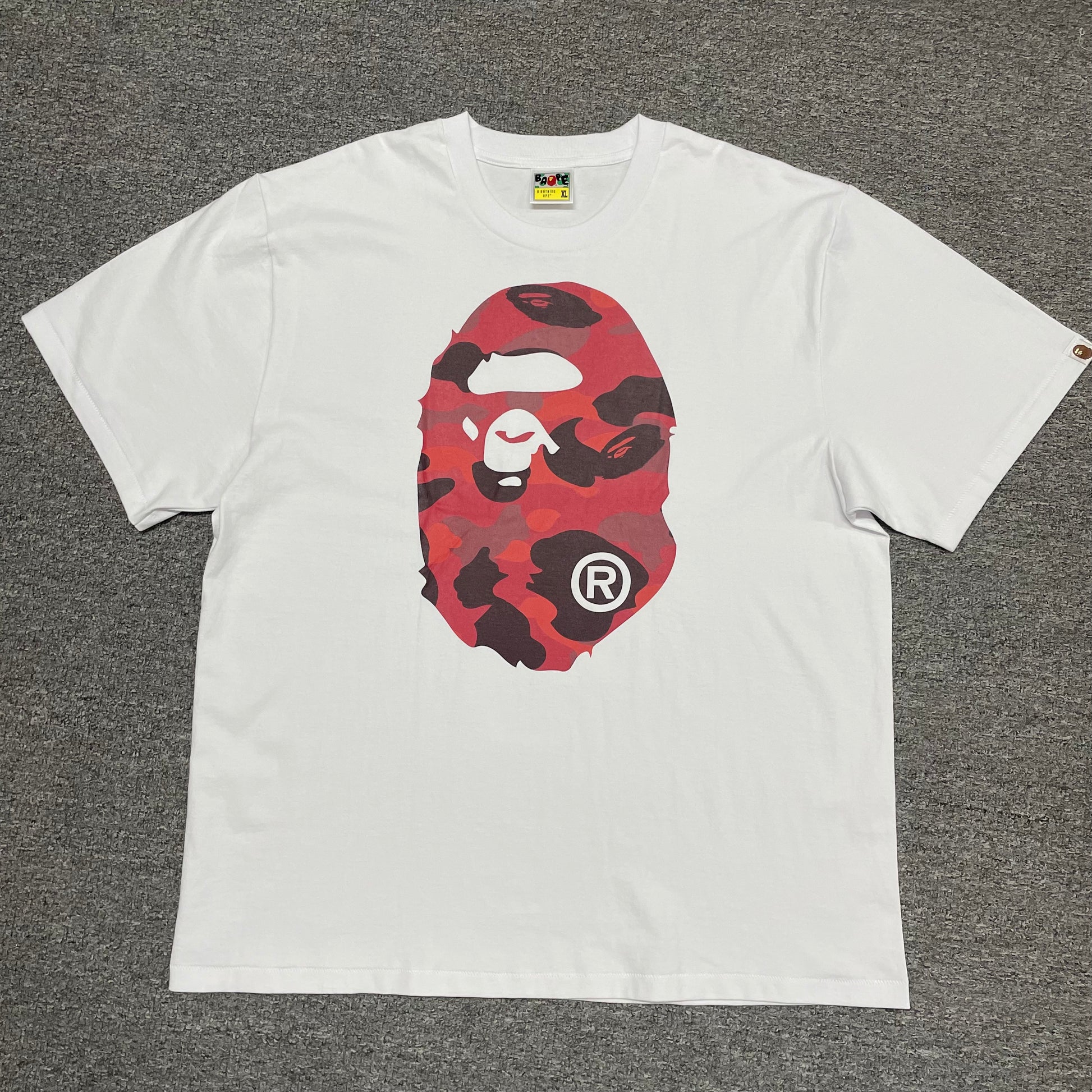 White BAPE Color Camo Big Ape Head T-shirt front view with red camo graphic