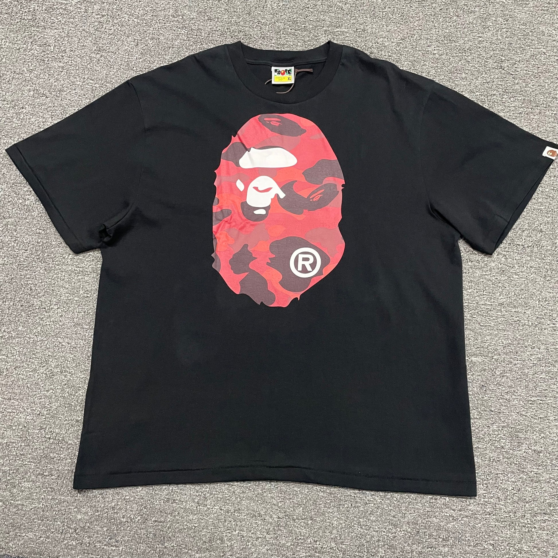 Black BAPE Color Camo Big Ape Head T-shirt front view with red camo graphic