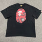 Black BAPE Color Camo Big Ape Head T-shirt front view with red camo graphic