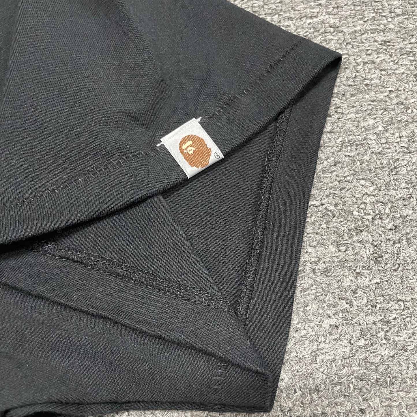 BAPE Ape Head sleeve label detail on black ABC Camo College T-shirt